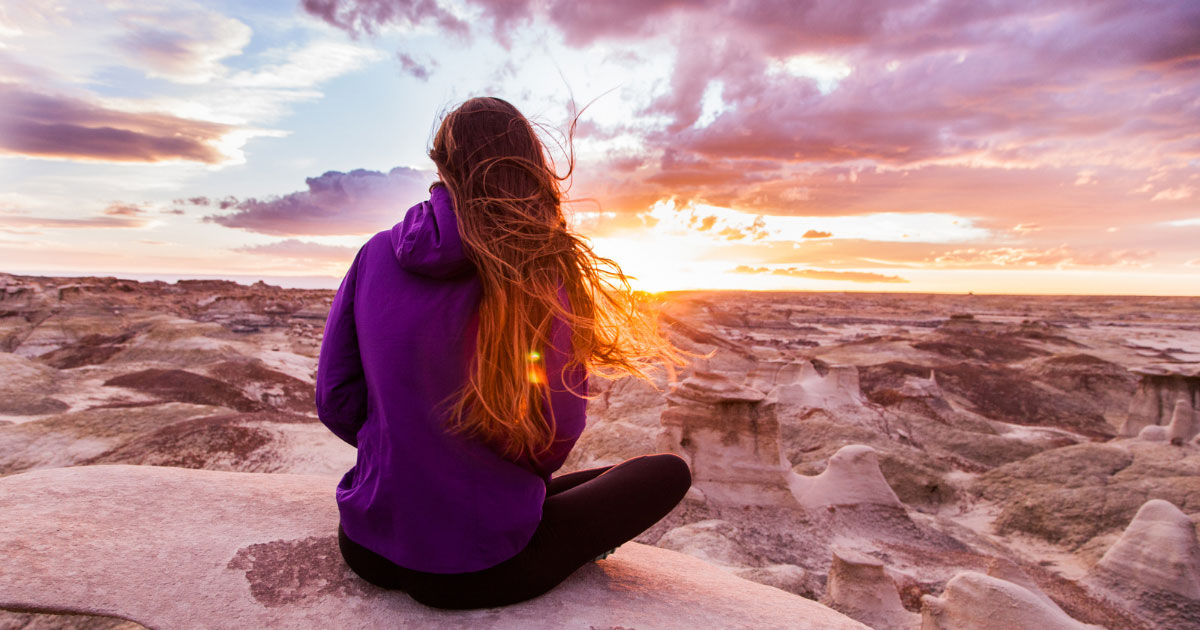 Young lady watching the sunset